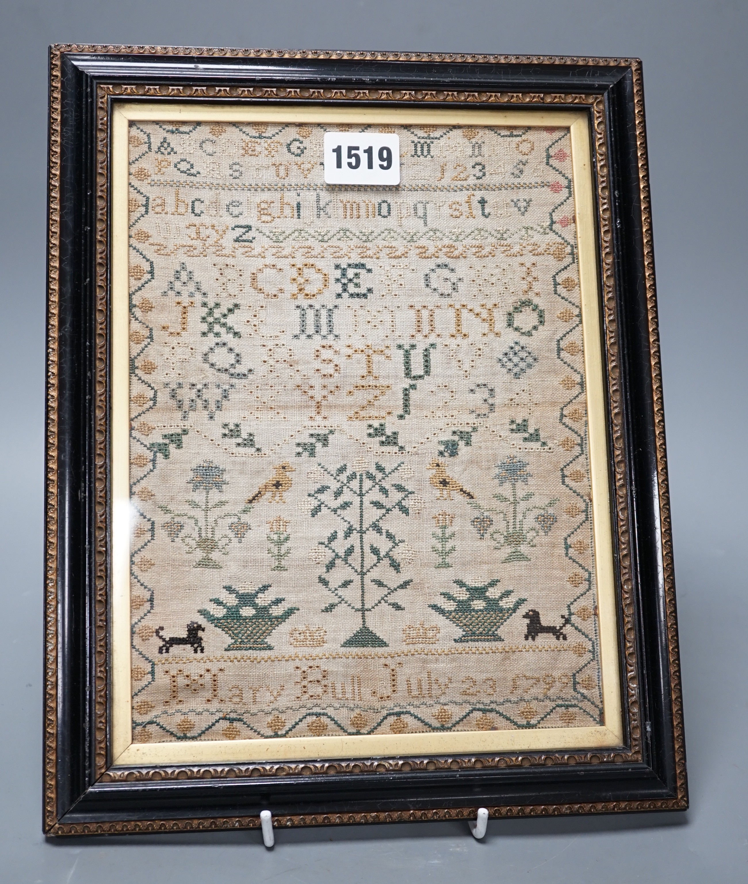 A George III sampler by Mary Bull, dated July 23 1799, 18cms wide x 23.5 high